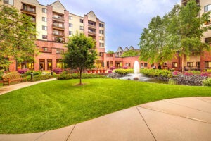 A well manicured lawn near a water feature at Covenant Living Golden Valley.