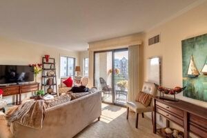 A resident enjoys their morning paper in their apartment.